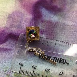 Rainbow stone lapel pin. 67